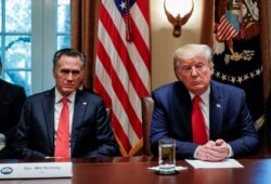 U.S. President Donald Trump listens to U.S. Senator Mitt Romney, R-Utah, during a listening session on the regulation of nicotine vaping and e-cigarettes in the Cabinet Room of the White House in Washington, Nov. 22, 2019.