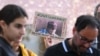 FILE - A demonstrator holds a picture of Iranian-German Jamshid Sharmahd with the lettering "Save Sharmahd" and "German politics has to act" during a demonstration for his release in front of the German Foreign Ministry in Berlin on July 31, 2023.