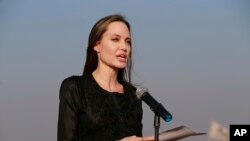 FILE - Angelina Jolie holds a news conference at Kutupalong refugee camp in Cox's Bazar, Bangladesh, Feb. 5, 2019. Jolie is not ruling out running for public office. The 43-year-old actress and U.N. special envoy tells People magazine “never say never!” 