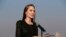 FILE - Angelina Jolie holds a news conference at Kutupalong refugee camp in Cox's Bazar, Bangladesh, Feb. 5, 2019. Jolie is not ruling out running for public office. The 43-year-old actress and U.N. special envoy tells People magazine “never say never!” 