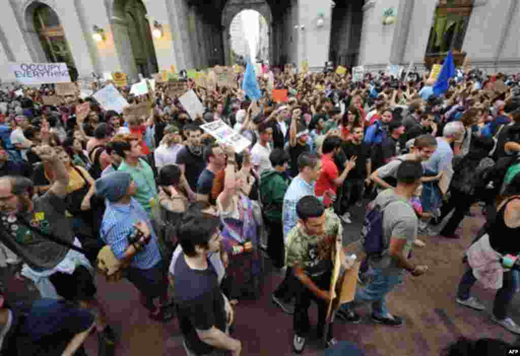 Protestors end their march at Police Headquarters, Friday, Sept. 30, 2011, in New York. The "Occupy Wall Street" protest is in its second week, as demonstrators speak out against corporate greed and social inequality. (AP Photo/ Louis Lanzano)