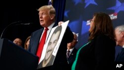 President Donald Trump speaks about immigration alongside family members affected by crimes committed by undocumented immigrants, at the South Court Auditorium on the White House complex, June 22, 2018, in Washington.