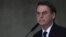 FILE - Brazil's President Jair Bolsonaro speaks at Planalto presidential palace in Brasilia, March 25, 2019.