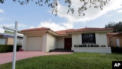 A report by S&P Case-Shiller claims a sharp rise in home prices over the past 12 months, increasing at the fastest pace since July 2014. Photo shows a house for sale in Coral Gables, Florida, Dec. 5, 2016. 