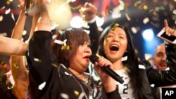 In this Jan. 14, 2014 photo, Rose Fostanes, a 47-year-old Filipino caregiver, sings during the X-Factor Israel in Tel Aviv, Israel. 