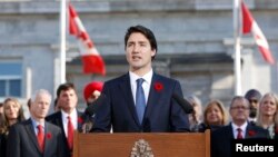 Canadian Prime Minister Justin Trudeau speaks to the crowds outside Rideau Hall after the Cabinet's swearing-in ceremony in Ottawa, Nov. 4, 2015.