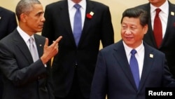 Le président Barack Obama (à g.) et son homologue chinois Xi Jinping (Reuters)