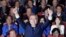 South Korea's presidential candidate Moon Jae-in of the Democratic Party raises his hands as his party leaders and members watch on television local media's results of exit polls for the presidential election in Seoul, South Korea, May 9, 2017. 