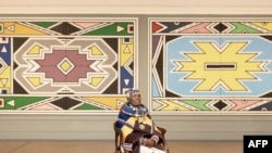 FILE — South African visual artist Esther Mahlangu poses during an interview ahead of the influential Ndebele artist’s major new retrospective opening at the Iziko South African National Gallery in Cape Town, on February 17, 2024.
