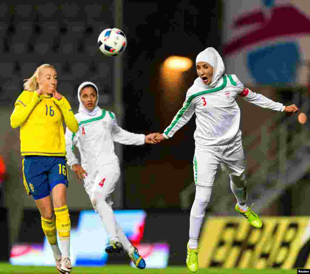 Iran&#39;s Koueistan Khosravi heads the ball in front of Sweden&#39;s Petra Andersson during the international friendly soccer match between Sweden and Iran at the Old Ullevi Soccer Stadium in Gothenborg, Sweden.