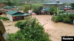 Submerged houses damaged by landslide and floods are seen in Lai Chau province, Vietnam, June 25, 2018. (Vietnam Red Cross/Ta Hong Long/Handout via Reuters)