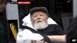 FILE - Jakiw Palij, a former Nazi concentration camp guard, is carried on a stretcher from his home in the Queens borough of New York, Aug. 20, 2018, in this frame from video. 