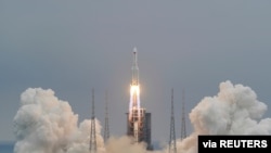 FILE - The Long March 5B rocket, carrying the core module of China's space station Tianhe, takes off from Wenchang Space Launch Center in Hainan province, China, April 29, 2021. (China Daily via Reuters) 