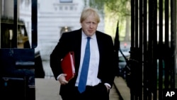 FILE - Britain's Foreign Secretary Boris Johnson arrives for a cabinet meeting at 10 Downing Street in London, May 1, 2018. 