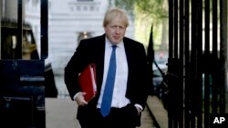 Britain's Foreign Secretary Boris Johnson arrives for a cabinet meeting at 10 Downing Street in London, Tuesday, May 1, 2018. 