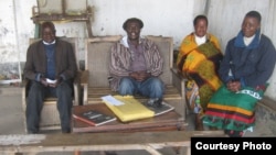 Somanje-Makata (second from left) sits at court in his Blantyre suburb with court advisers. (Photo by Lameck Masina)