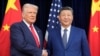 资料照片：美国总统唐纳德·特朗普与中国国家主席习近平2025年10月30日在韩国釜山会面前握手。