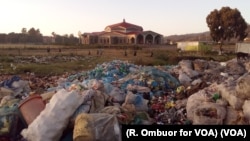 Children walk to school near the Ngong dump in Nairobi. Last year, 16 infants, including some still alive, were found there in one of Kenya’s largest landfills.