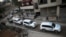 An aid convoy of Syrian Arab Red Crescent and UN drives through the rebel held besieged city of Douma towards the besieged town of Kafr Batna to deliver aid, on the outskirts of Damascus, Syria, Feb. 23, 2016. 
