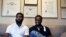 Rashon Nelson, left, and Donte Robinson, right, sit on their attorney's sofa following an interview with The Associated Press in Philadelphia, April 18, 2018.