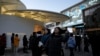 Shoppers visit a popular mall in Beijing, Dec. 15, 2024. 