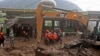 Rescuers carry the body of a victim of the landslide in Karo, North Sumatra, Indonesia, Nov. 25, 2024.