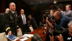 /From left: NSA Director Gen. Keith B. Alexander; Deputy FBI Director Sean Joyce, and Robert Litt, general counsel to the Office of the Director of National Intelligence (DNI), arrive to testify before a House Intelligence Committee hearing regarding NSA surveillance, on Capitol Hill, in Washington, June 18, 2013.