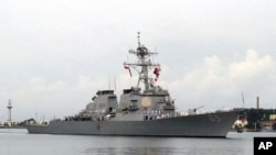 FILE - The guided missile destroyer USS Benfold arrives at port in Qingdao, China, Aug. 8, 2016. The Benfold was one of two warships that passed through the Taiwan Strait on July 7, 2018. 