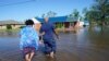In Hurricane-Ravaged Louisiana, Residents Dig out, Again 