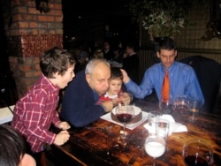 Leslie Gelb, his son Adam, and two of his grandsons are seen at a family birthday celebration. (Courtesy - Gelb family)