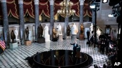 President Joe Biden speaks from Statuary Hall at the U.S. Capitol to mark the one year anniversary of the Jan. 6 riot at the Capitol by supporters loyal to then-President Donald Trump, in Washington.