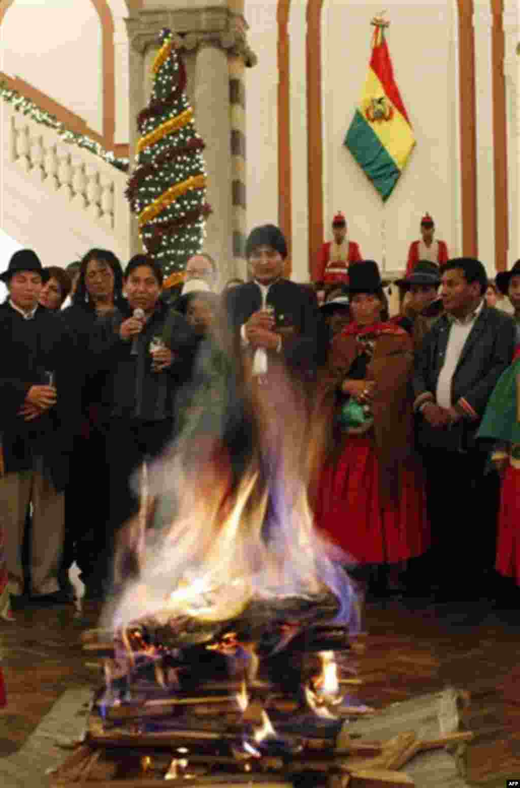 Bolivia's President Evo Morales, third right, attends an Andean ritual at the presidential palace in La Paz, Bolivia, Friday, Jan. 6, 2012. The so-called 'Amautas', or spiritual counselors, led the ritual organized to thank the 'Pachamama,' or Mother Eart