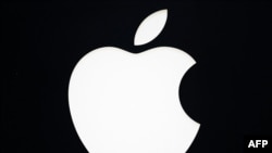 (FILES) This photograph shows the logo of Apple at an Apple store on the Champs-Elysee avenue in Paris, on March 18, 2024.