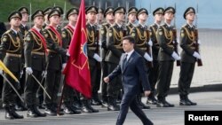 Ukraine's President Volodymyr Zelenskiy takes part in the Independence Day military parade in Kyiv, Ukraine, Aug. 24, 2021. 