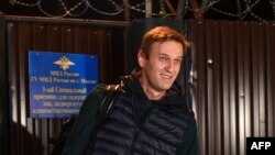 Russian opposition leader Alexei Navalny leaves the detention center in Moscow, early Oct. 14, 2018. He was released after three weeks for organizing anti-Kremlin protests, his second spell in detention in as many months.