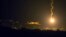 A picture taken from the southern Israeli border with the Gaza Strip shows Israeli flares illuminating the Palestinian coastal enclave, July 7, 2014.