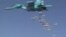 FILE - A still image, taken from video footage and released by Russia's Defense Ministry on Aug. 18, 2016, shows a Russian Sukhoi Su-34 fighter-bomber dropping bombs in the Syrian province of Deir ez-Zor. 