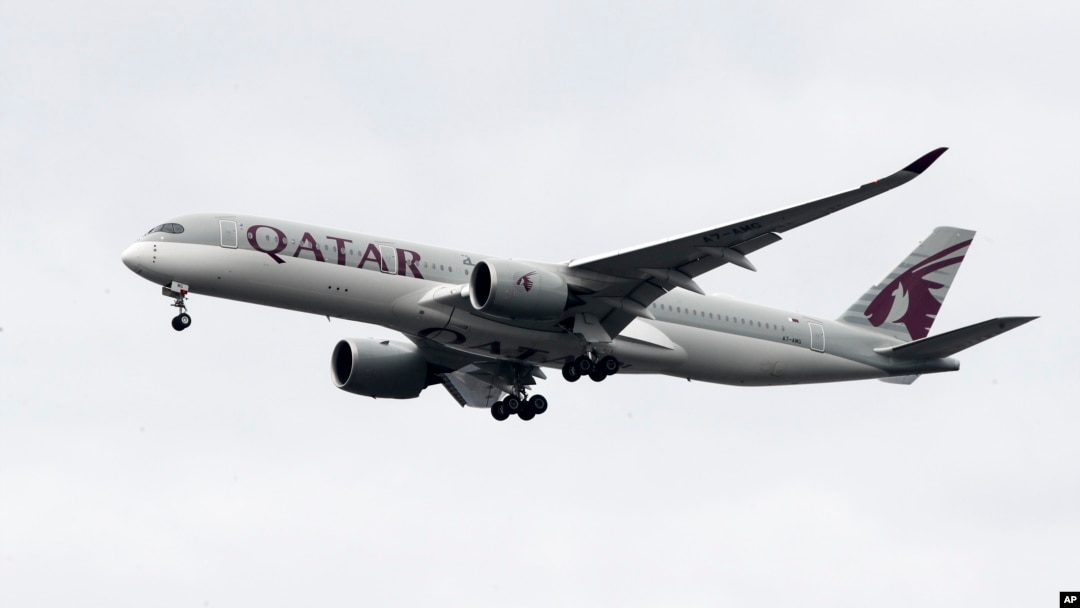 FILE - A Qatar Airways jet approaches Philadelphia International Airport in Philadelphia, Nov. 7, 2019. On Sept. 24, 2024, Qatar became the second Muslim-majority nation to join the U.S.'s visa waiver program. 