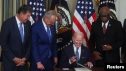 U.S. President Joe Biden signs "The Inflation Reduction Act of 2022" into law at the White House in Washington