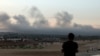 Smoke billows over southern Lebanon following Israeli strikes, amid ongoing cross-border hostilities between Hezbollah and Israeli forces, as seen from Tyre, southern Lebanon, Sept. 23, 2024. 