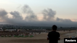 Smoke billows over southern Lebanon following Israeli strikes, amid ongoing cross-border hostilities between Hezbollah and Israeli forces, as seen from Tyre, southern Lebanon, Sept. 23, 2024. 