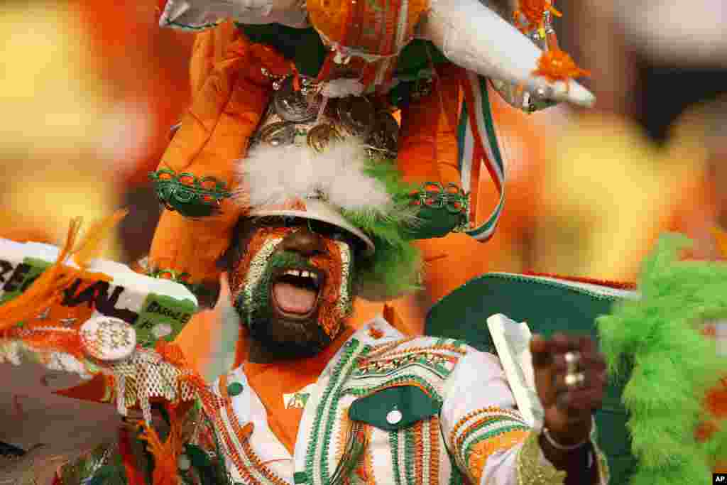 Ivory Coast fan cheers before the African Cup of Nations group D soccer match between Morocco and Ivory Coast in al Salam Stadium in Cairo, Egypt.