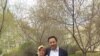 This picture shows Yahya Kurban and Amina Kurban standing in the garden of their apartment complex in Urumqu, the capital city of Xinjiang, China. (Photo courtesy Hankiz Kurban)