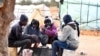 FILE—Migrants from Sub-Saharian Africa gather around a fire at a camp in Jebeniana in Tunisia's Sfax governorate on April 24, 2024.