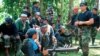 Juru bicara Abu Sayyaf, Abu Sabaya (kanan), bersama anggota kelompok militan itu dalam foto yang tidak bertanggal. Militer Filipina berhasil menangkap seorang pemimpin Abu Sayyaf, yang dituding dibalik sejumlah penculikan, Minggu, 21 Maret 2021.