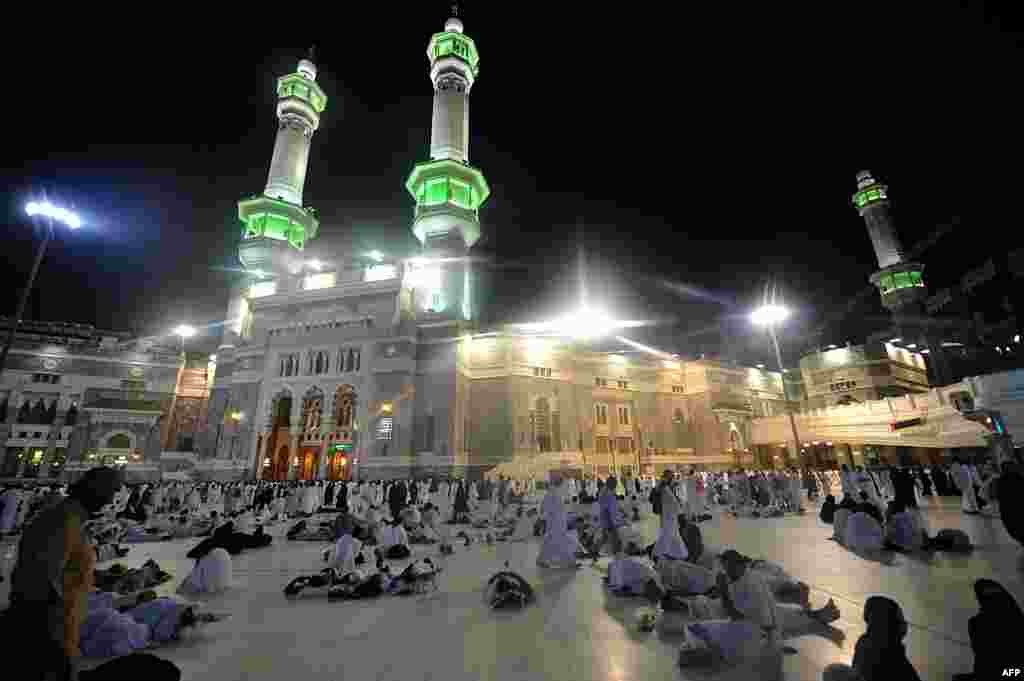 Muslim piligrims are seen ahead of morning prayers in Mecca's Grand Mosque, on October 13, 2013.