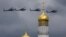 Russian military helicopters fly over the Ivan the Great bell-tower and Kremlin during a rehearsal in Moscow, Russia, May 5, 2016.
