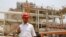 An Iranian workerin the partially constructed site which is part of South Pars gas field, Assalouyeh, Iran, Monday, July 19, 2010. (AP Photo/Vahid Salemi)