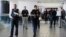 LAPD officers walk around terminal 3 after a shooting at Los Angeles airport (LAX), California, Nov. 1, 2013.
