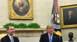FILE - President Donald Trump, right, speaks while meeting with Spain's King Felipe VI, left, in the Oval Office of the White House in Washington, June 19, 2018.